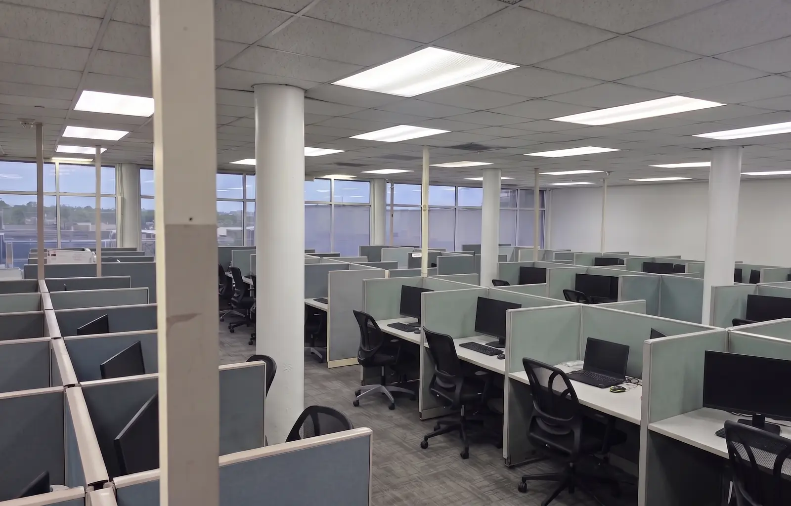Workstations on the DirecOne operations floor in Port of Spain